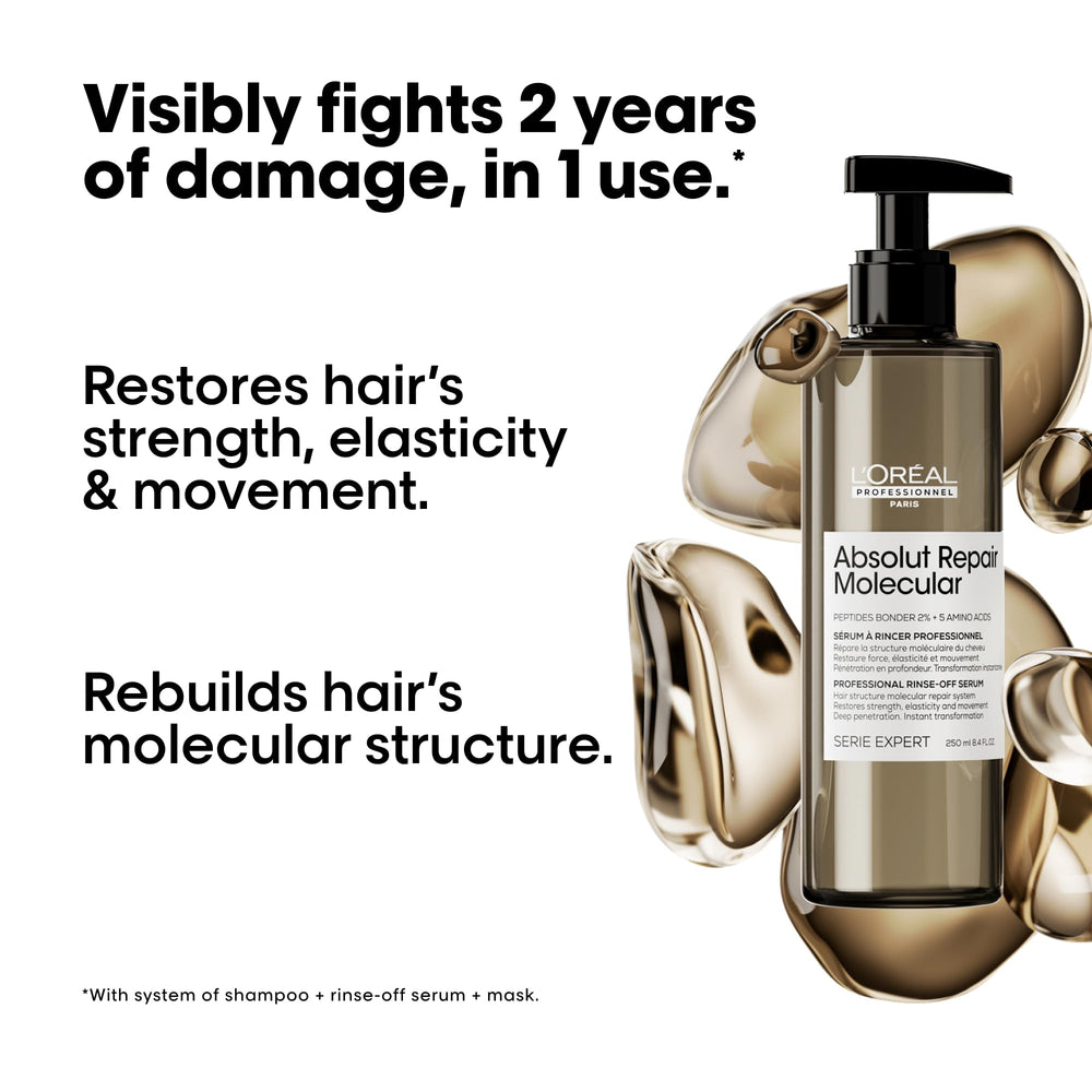 L'Oréal Professionnel Paris Absolut Repair molecular serum applied along hair lengths for repair.
