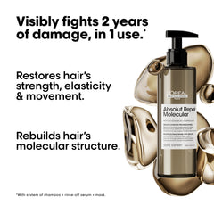L'Oréal Professionnel Paris Absolut Repair molecular serum applied along hair lengths for repair.