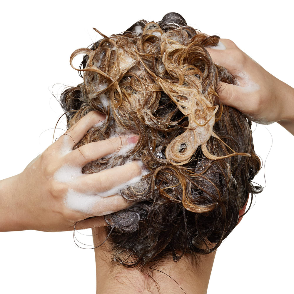 Inforcer shampoo bottle with Biotin and B6 branding indicates strengthened hair fiber