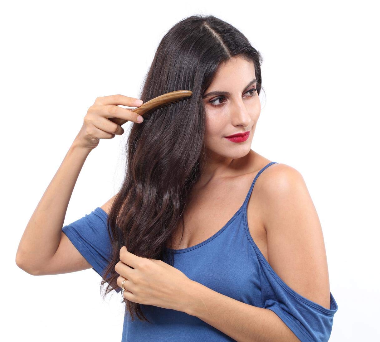 Louise Maelys wooden comb with smooth texture and craftsmanship.