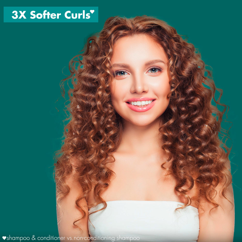 Creamy conditioner texture suggesting detangling and curl nourishment.
