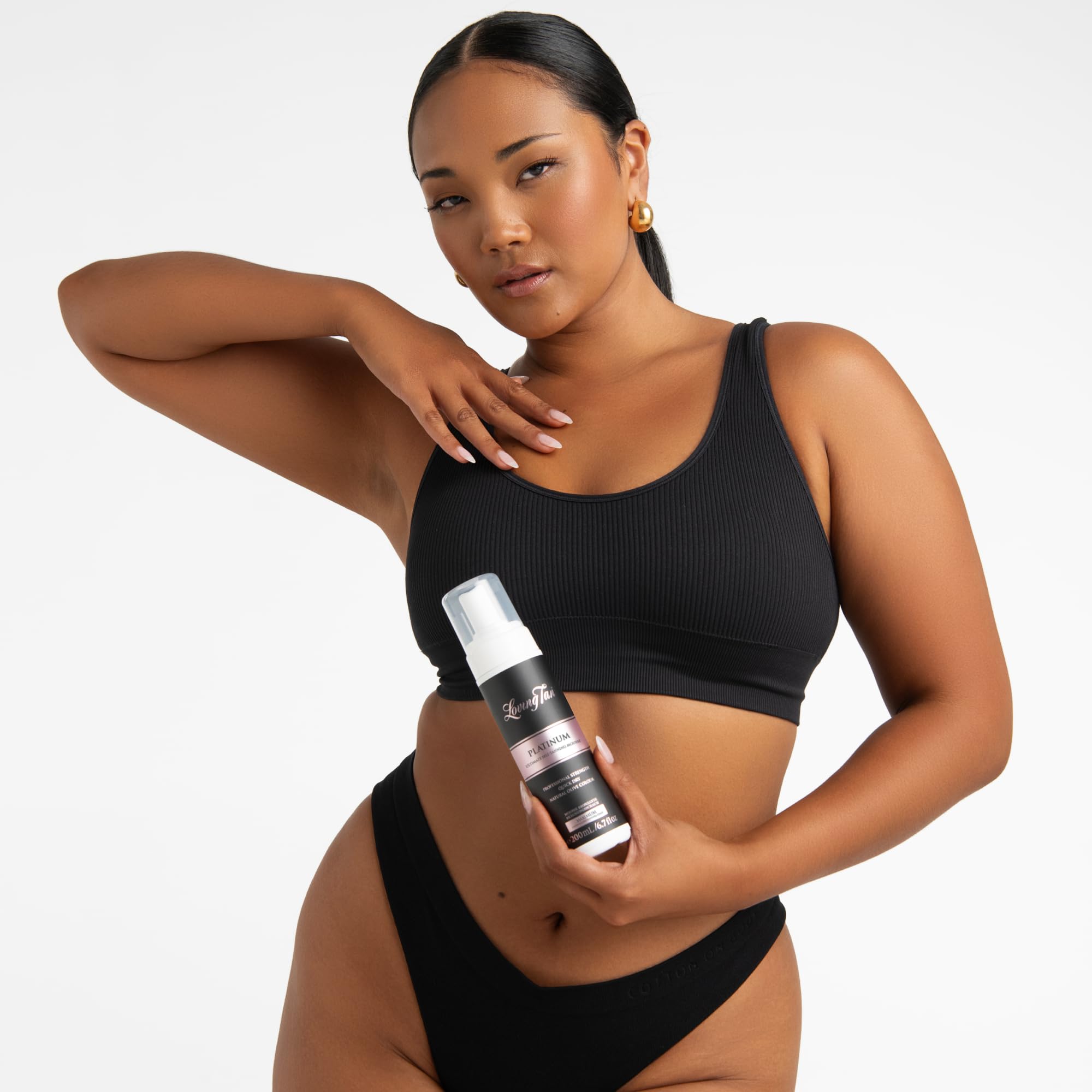 Loving Tan Platinum Self-Tanning Mousse with mitt for smooth, streak-free coverage.