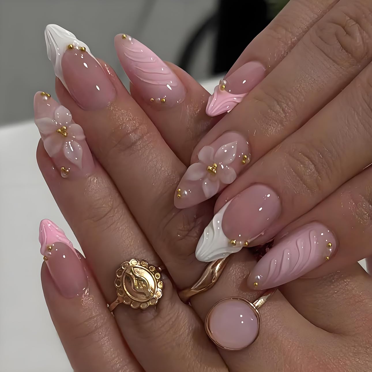 LPOODDNU 3D pink almond press-on nails for a quick at-home manicure.
