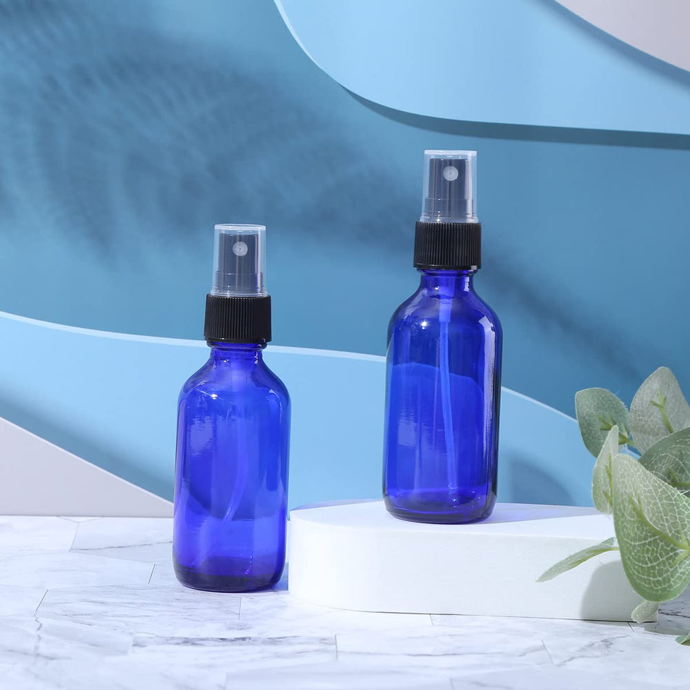 LUFEVRM 2oz blue glass spray bottle nozzle detail, precise fine mist.