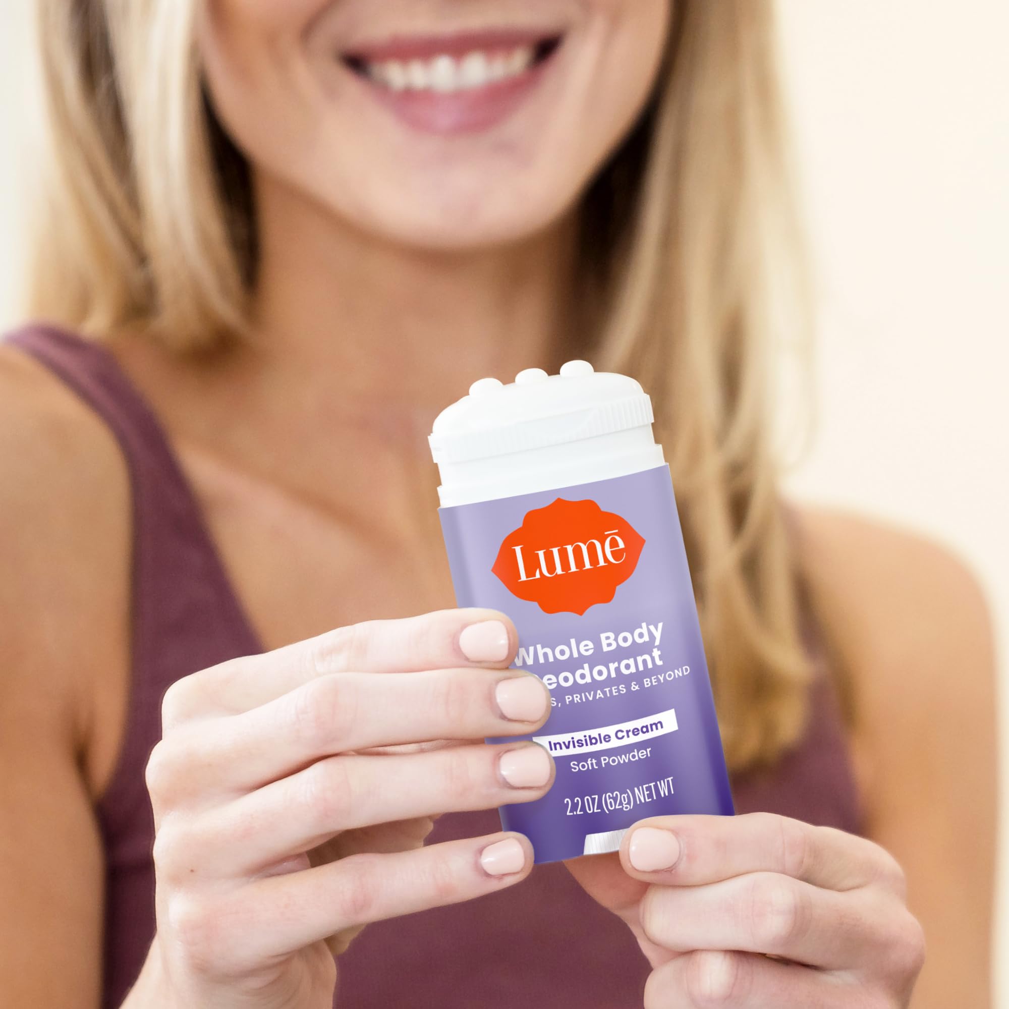 Lume cream stick application on body skin.
