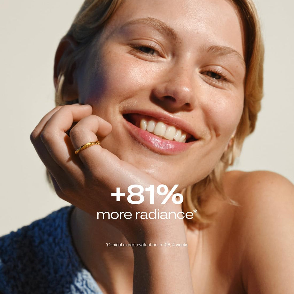 Lumene dropper delivering precise dosage of glow-boosting serum.