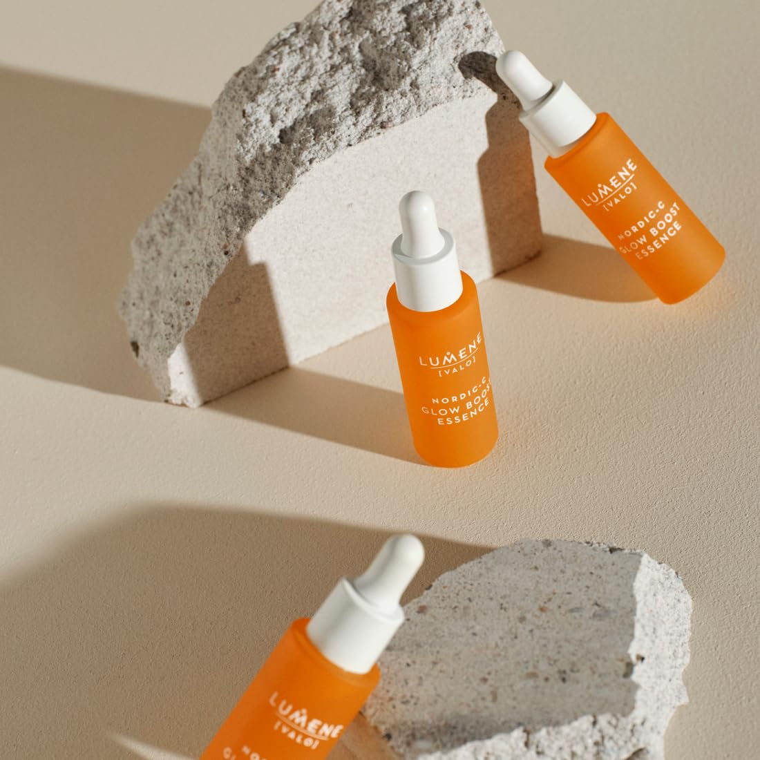 Lumene Nordic-C Valo Glow Boost bottle with vibrant orange glass.