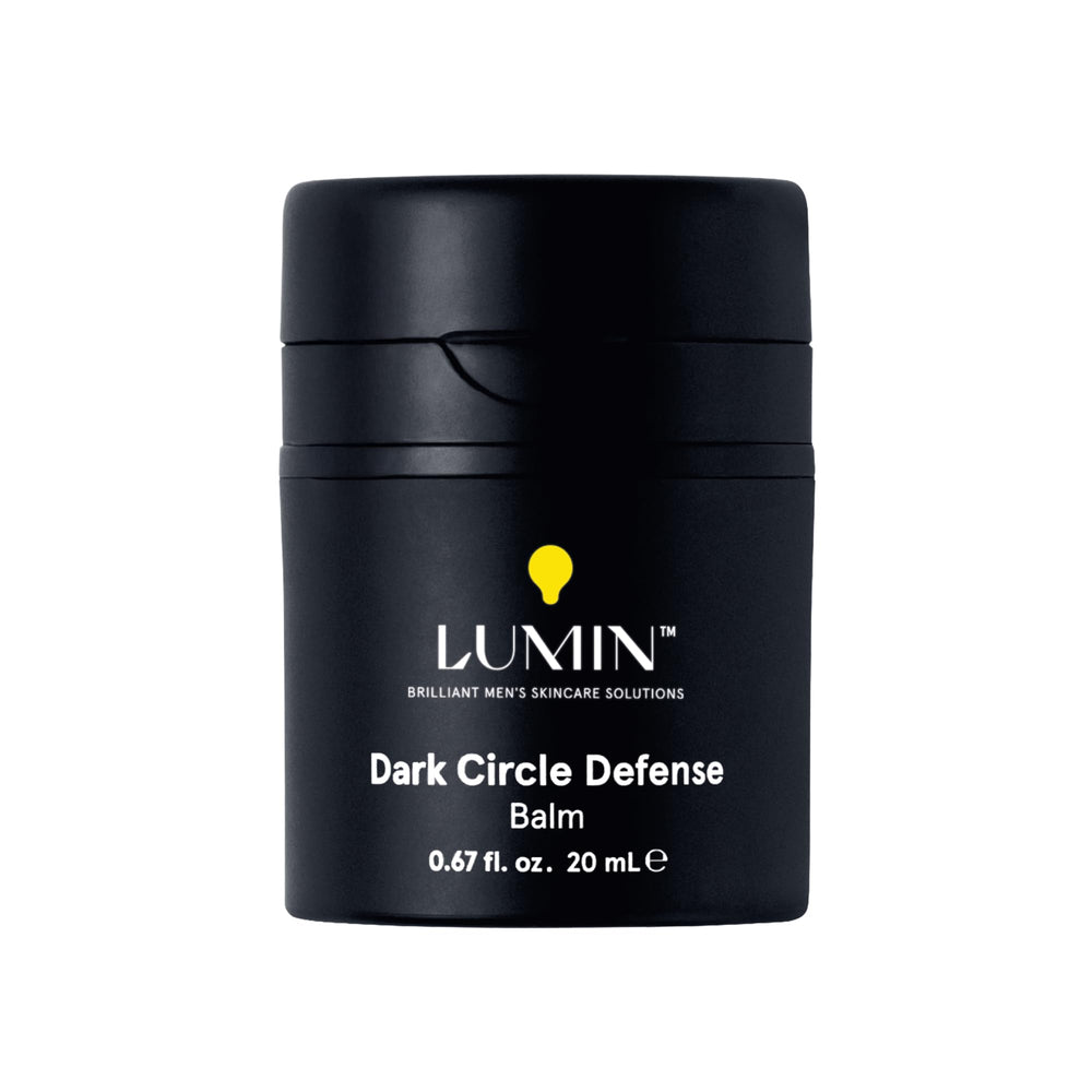Lumin Men's Dark Circle Defense Balm tube close-up showing lightweight under-eye hydration