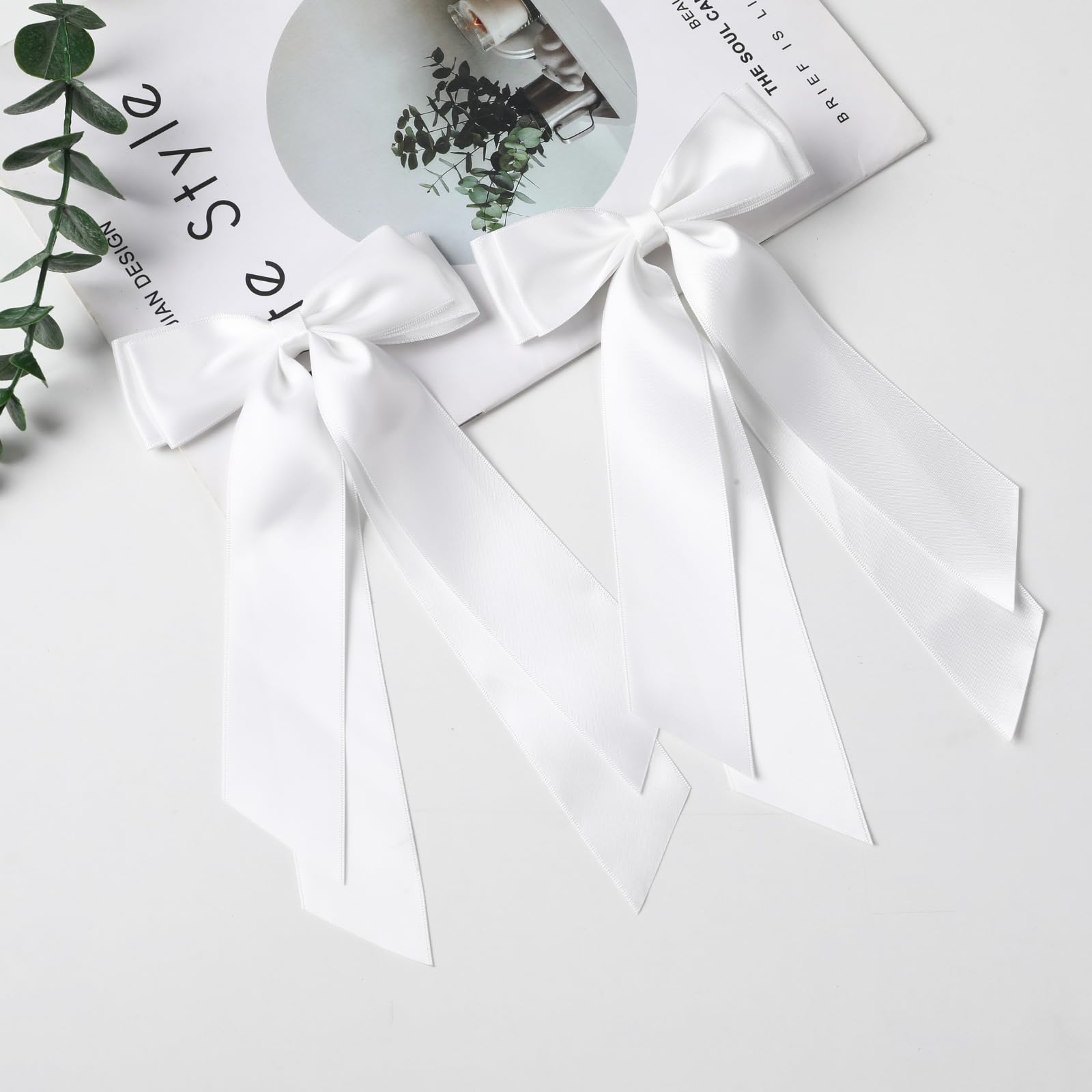 LuSeren white satin bows worn at weddings or parties.