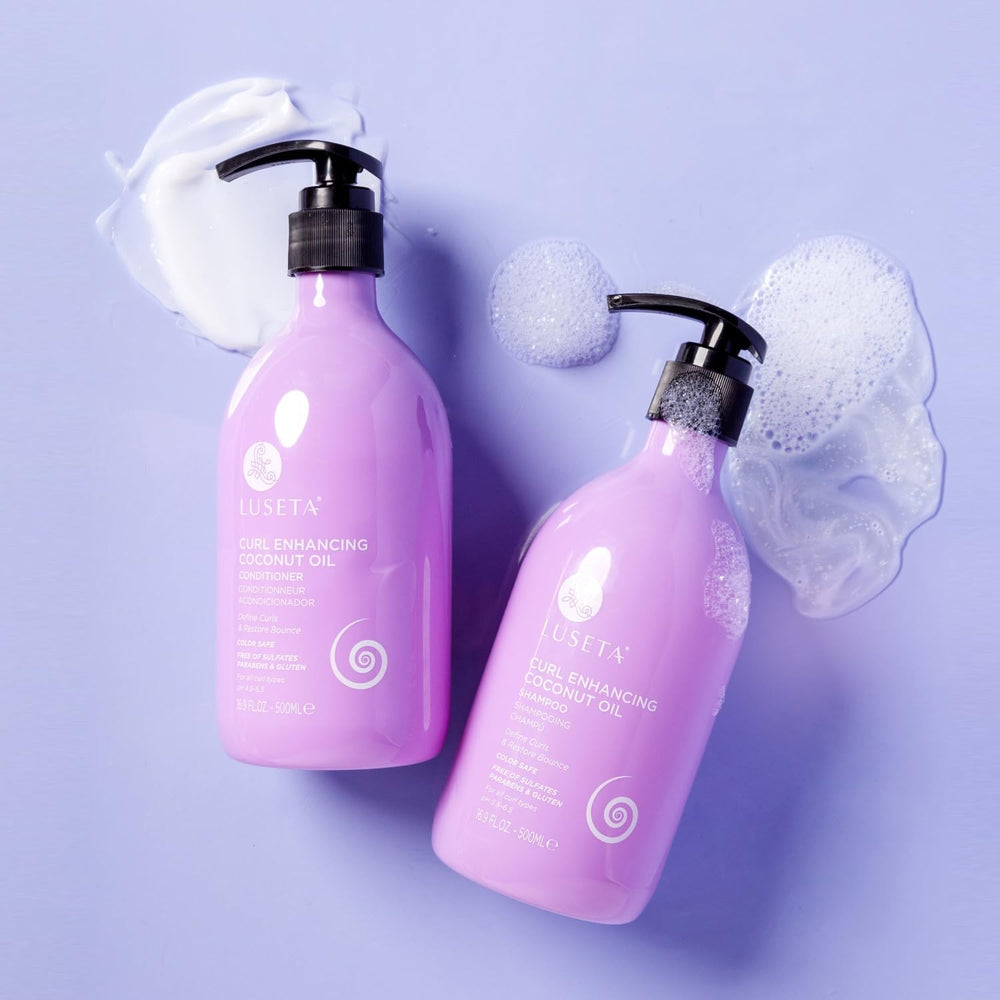 L LUSETA Luseta Shampoo bottle beside rosemary leaf oil for healthier scalp feel.