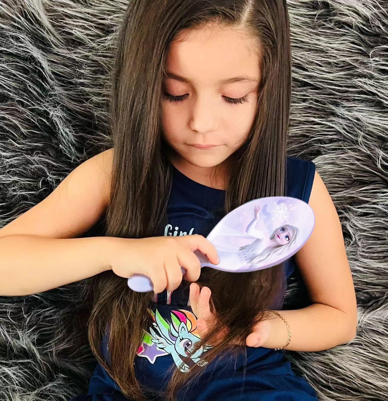 Luv Her Frozen Elsa hairbrush back design with playful Elsa art.