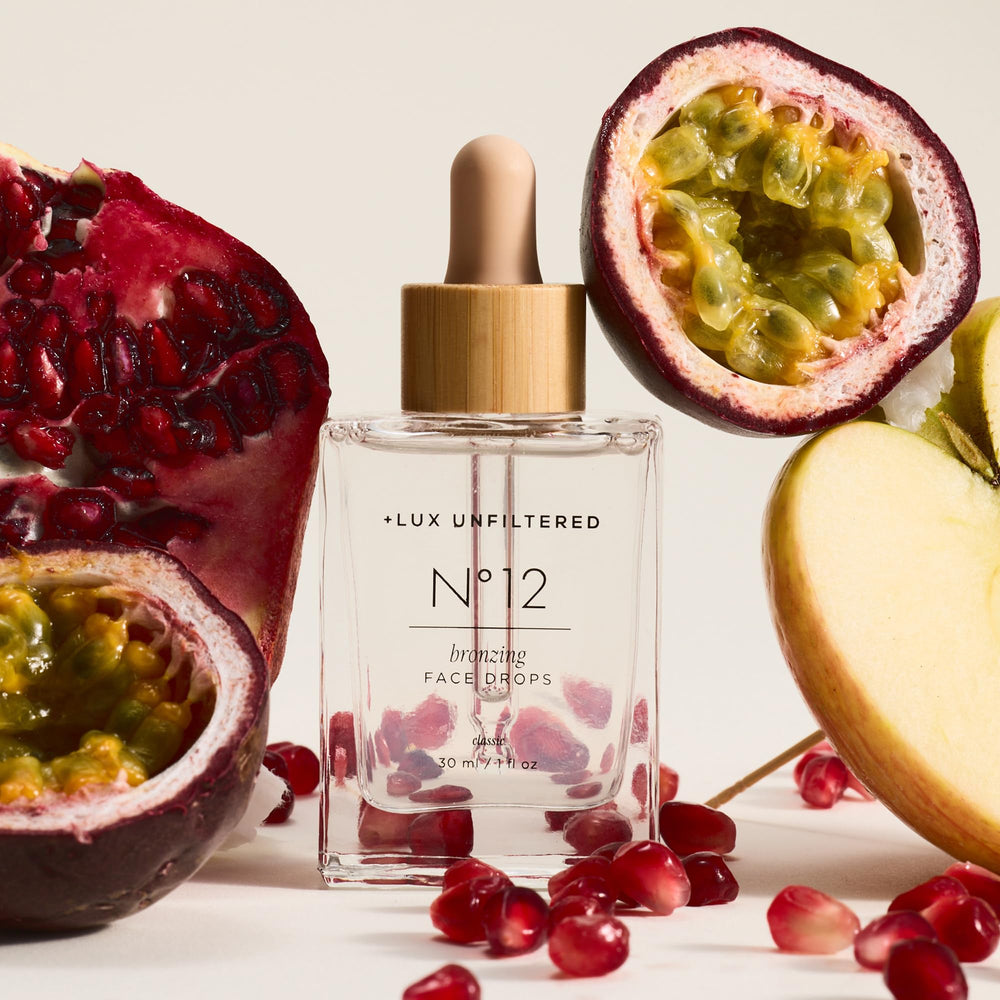 Lux Unfiltered N°12 dropper in use delivering controlled facial tan