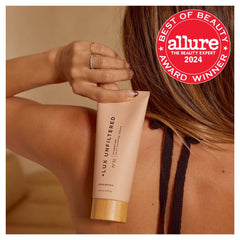 Lux Unfiltered N32 gradual self tanner being applied for a buildable glow