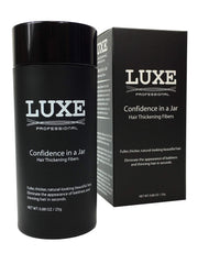 LUXE Hair Building Fibers jar cap shows secure lid for travel-friendly use.
