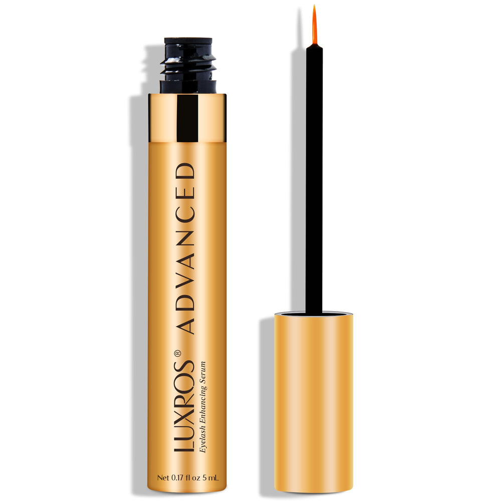 LUXROS eyelash growth serum bottle on a vanity for paraben-free daily care.