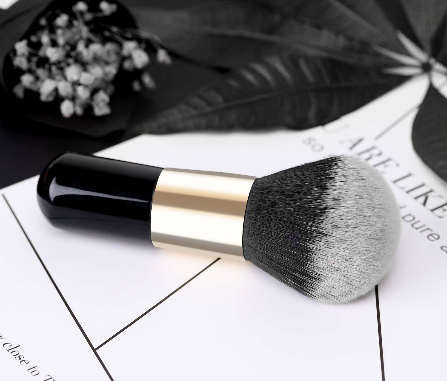 Luxspire brush with makeup swatches on skin illustrating blending.