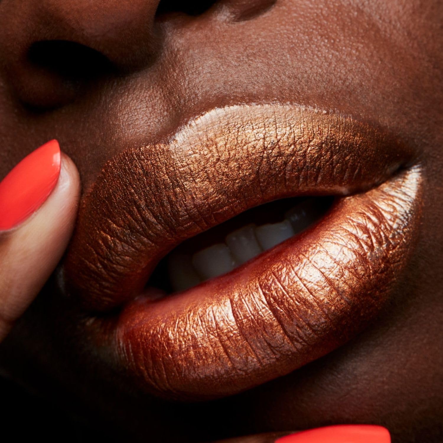MAC Frost Lipstick Bronze Shimmer applied on lips for a luminous finish
