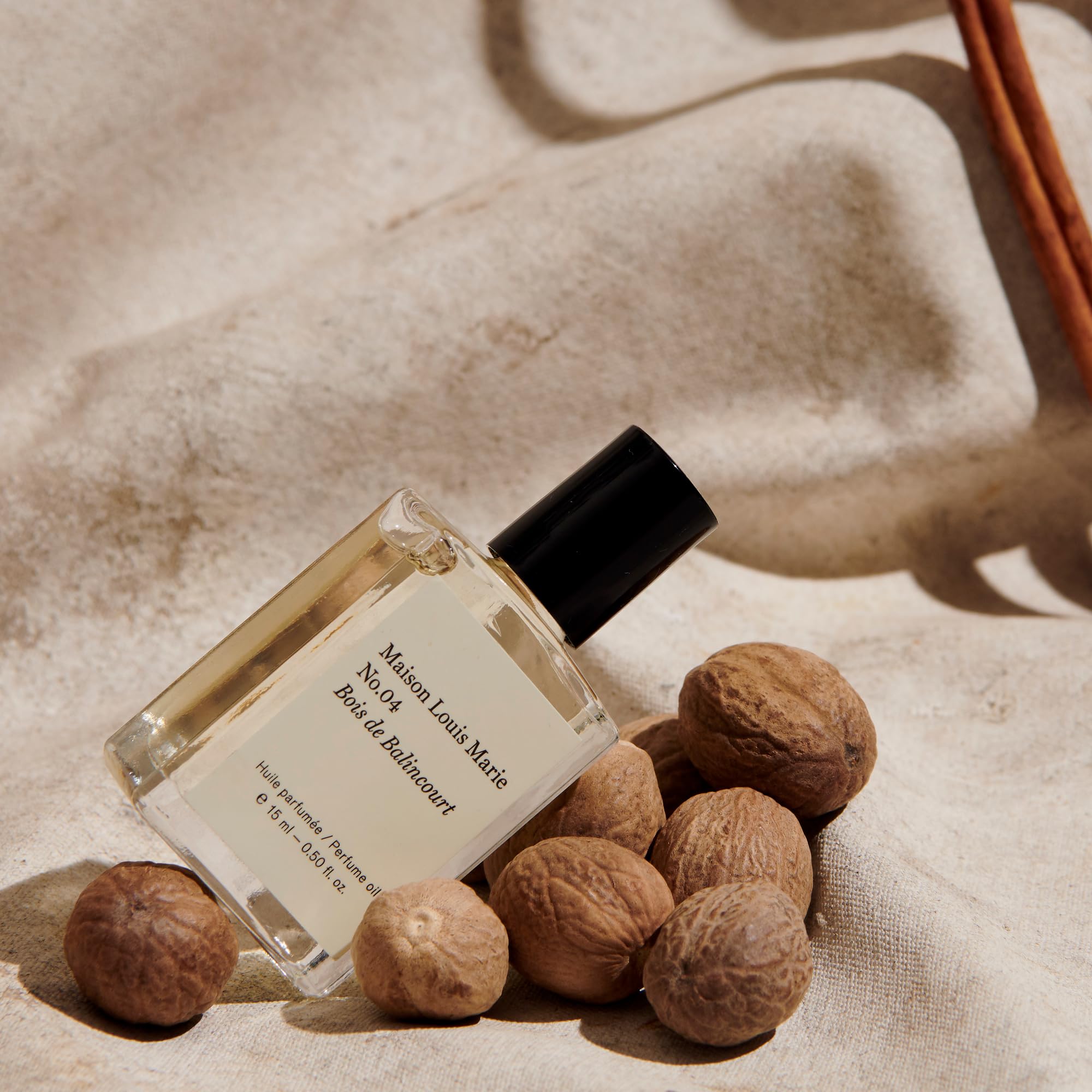 Maison Louis Marie No.04 Bois de Balincourt pulse-point application showing easy roll-on use for quick touch-ups.