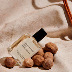 Maison Louis Marie No.04 Bois de Balincourt pulse-point application showing easy roll-on use for quick touch-ups.