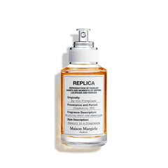 Maison Margiela Replica By the Fireplace bottle front view evokes a warm, cozy atmosphere.