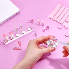 Makartt press-on nails stand in pink base for stylish design sessions.