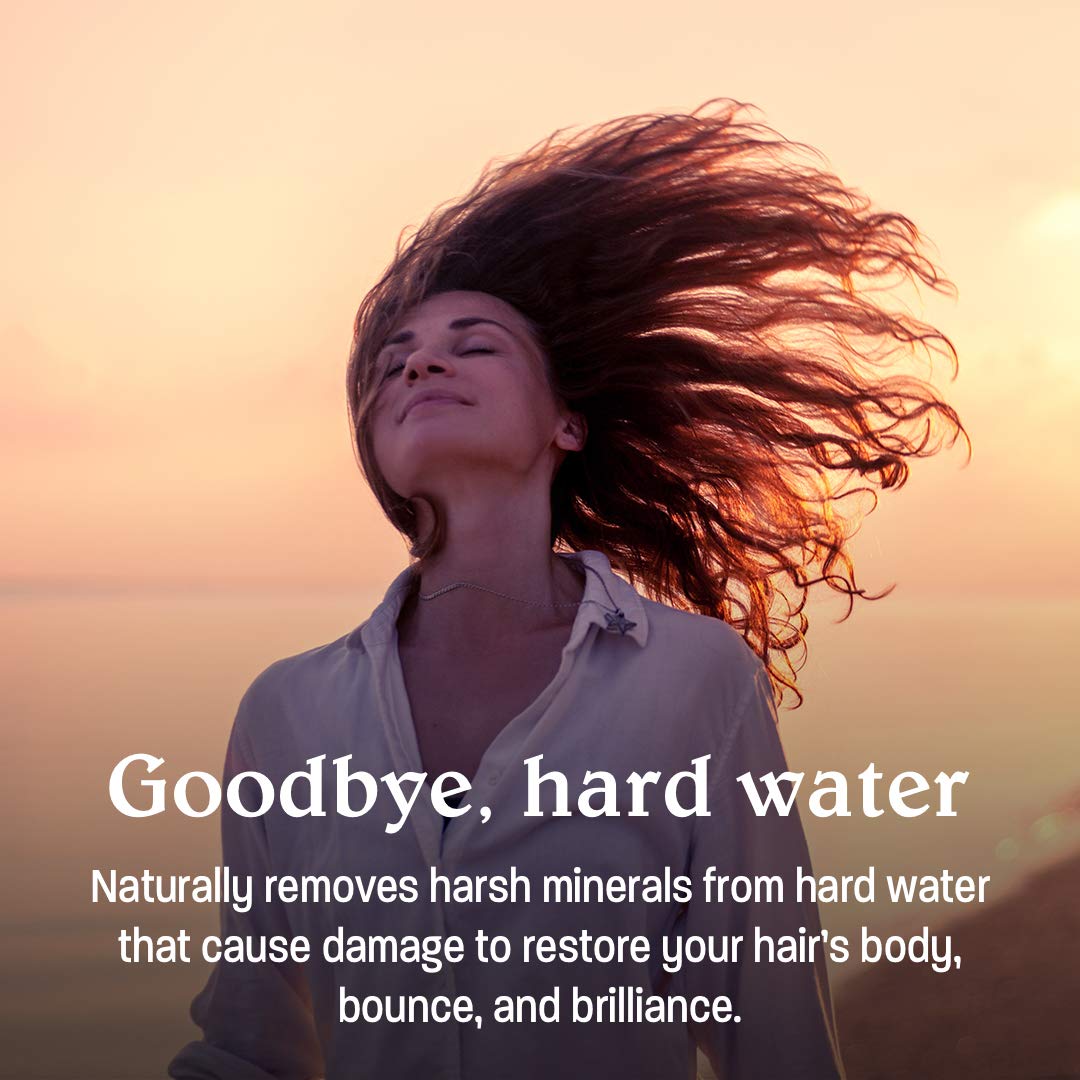Shampoo bottle on bathroom shelf emphasizing plant-based formula