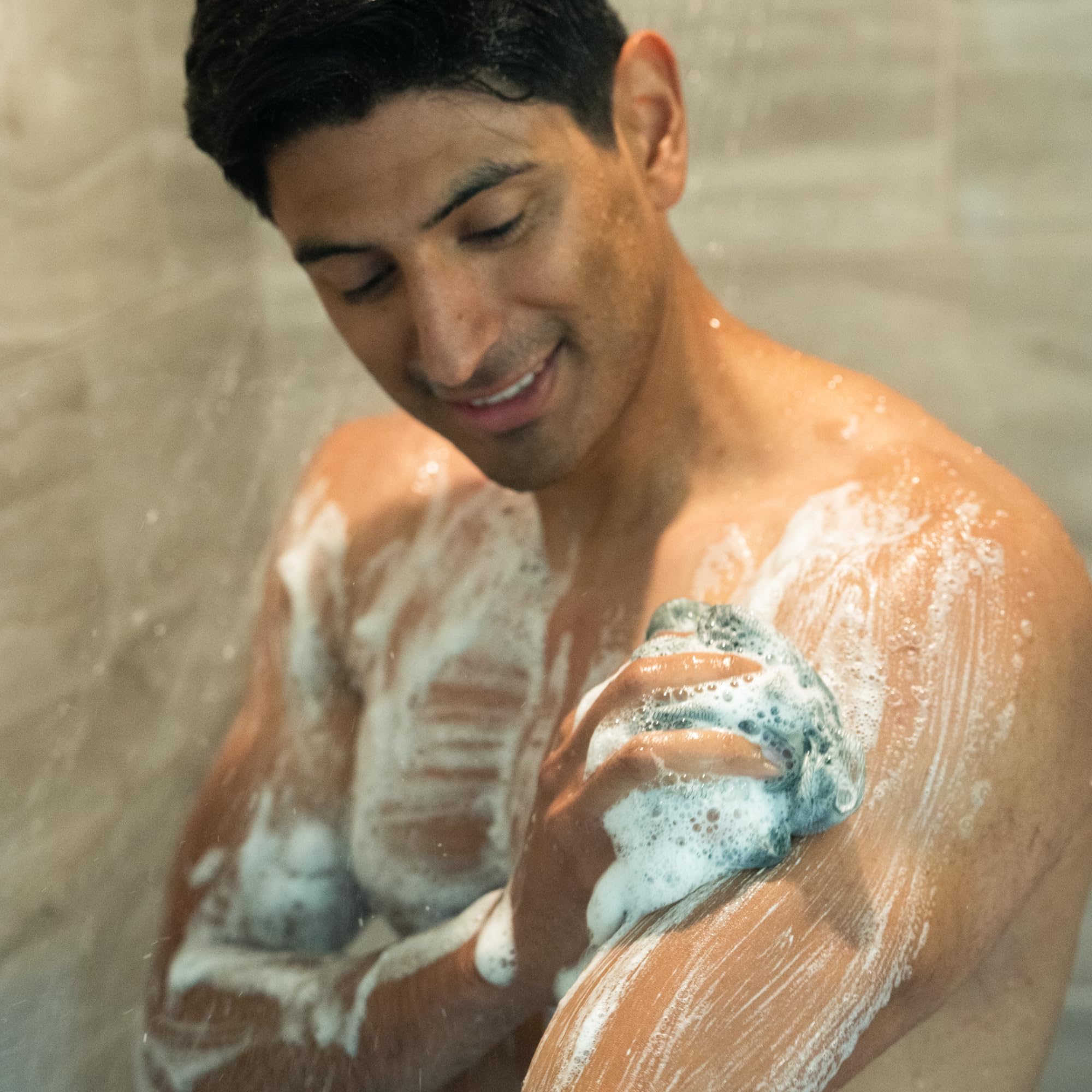 Mando Odor Shield in shower scene suggests daily odor-control routine.