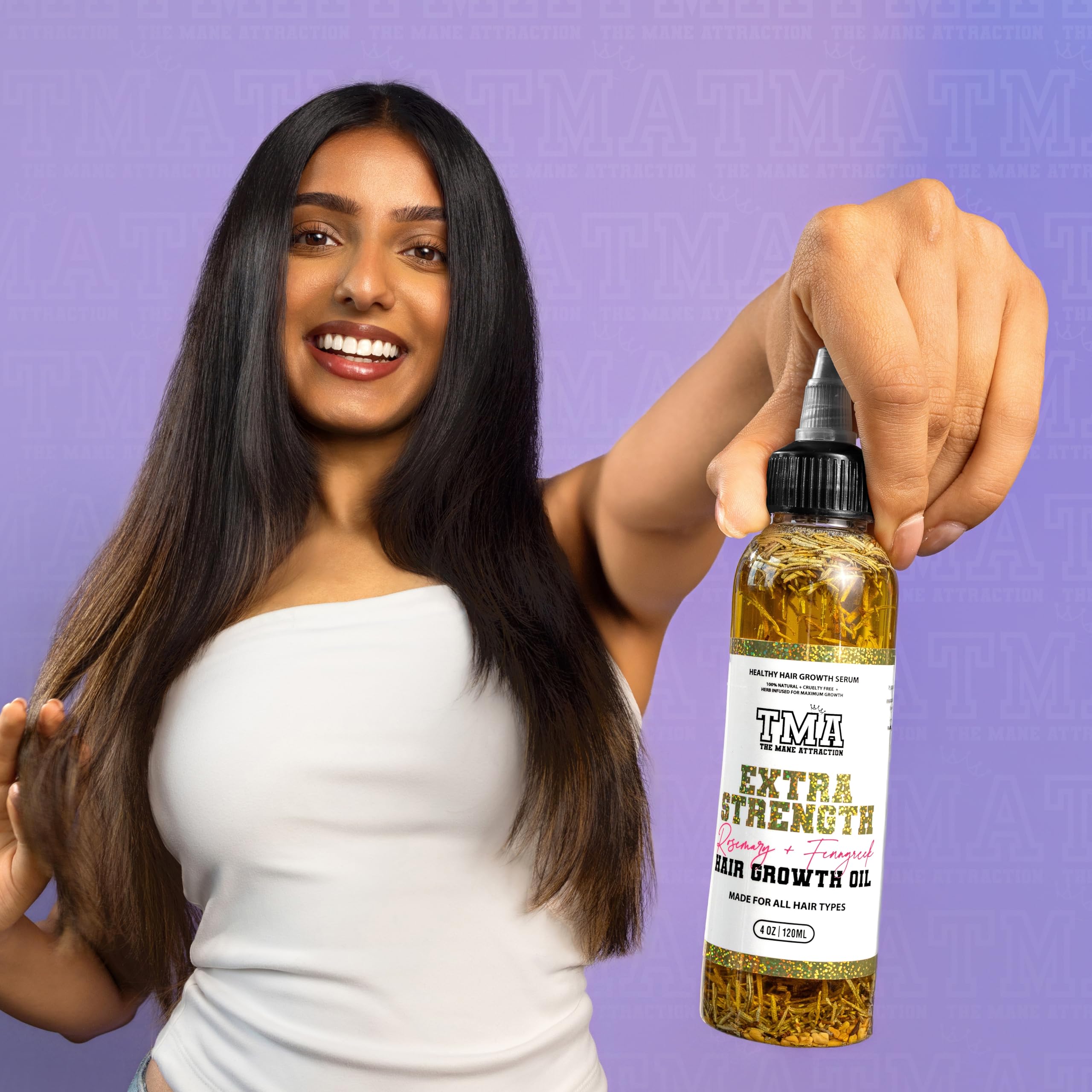 The Mane Attraction oil on hair-length demonstrating moisture retention potential