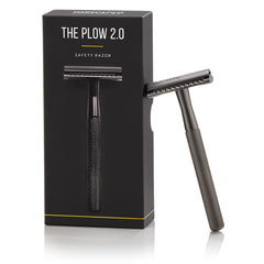 MANSCAPED The Plow 2.0 brass handle close-up for premium grip.