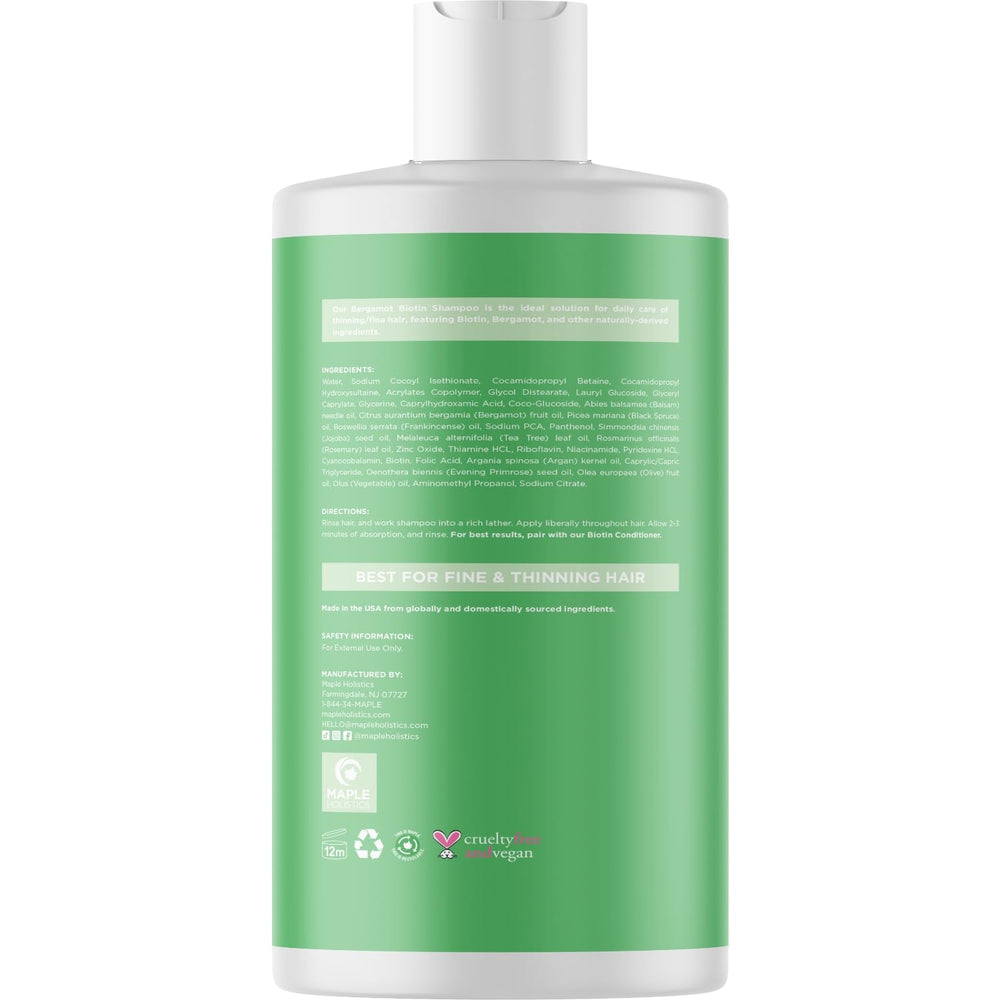 Hands massaging shampoo through hair in shower for fullness