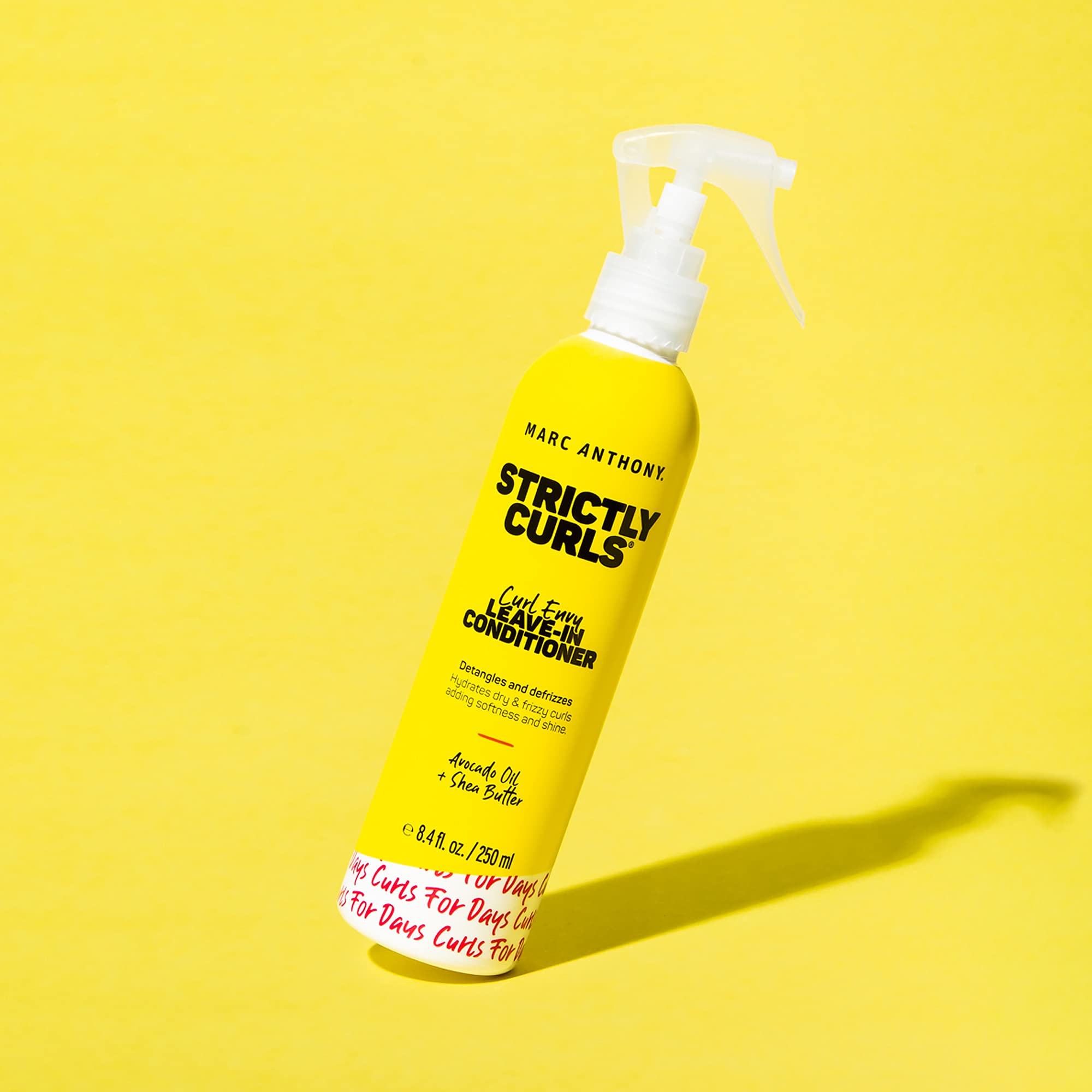 Marc Anthony Leave-In applied to damp hair for smooth styling.