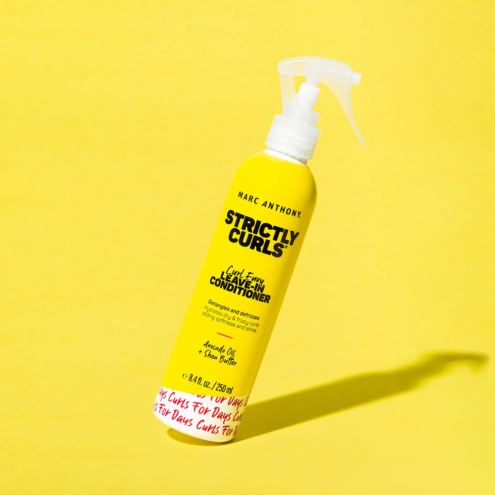 Marc Anthony Leave-In applied to damp hair for smooth styling.