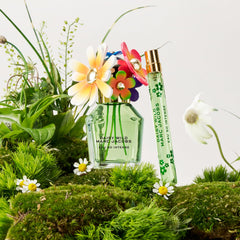 Marc Jacobs Daisy Wild Intense floral notes closeup, highlighting banana blossom and jasmine for a luminous aura