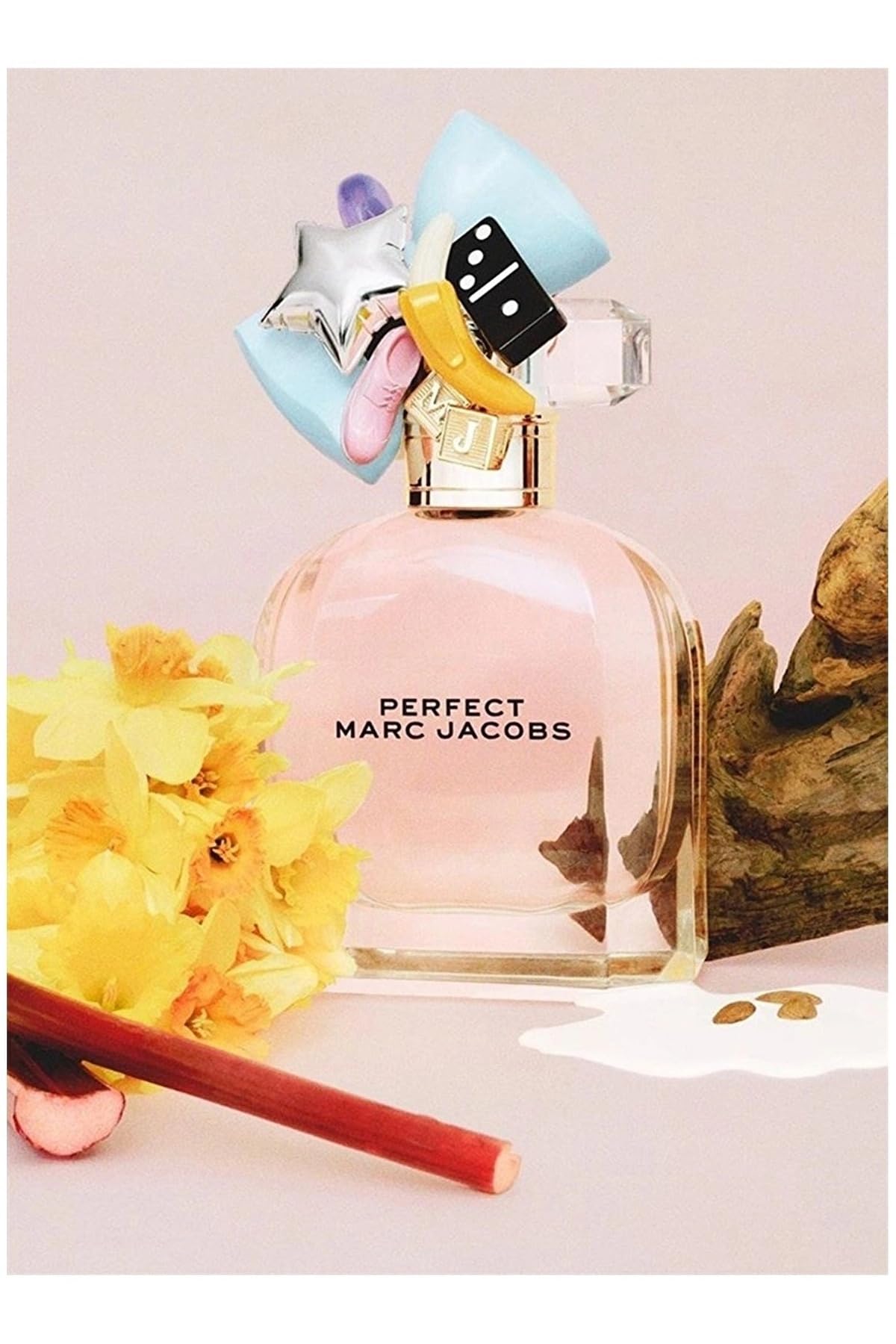 Marc Jacobs Perfect packaging highlights a pink bottle and charms
