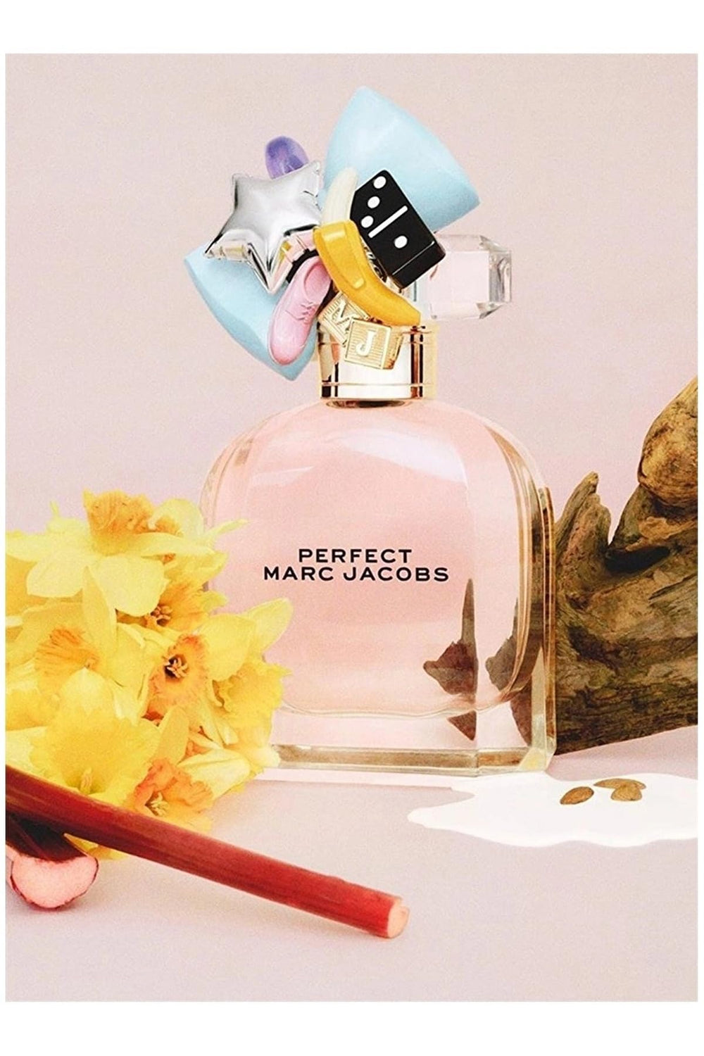 Marc Jacobs Perfect packaging highlights a pink bottle and charms