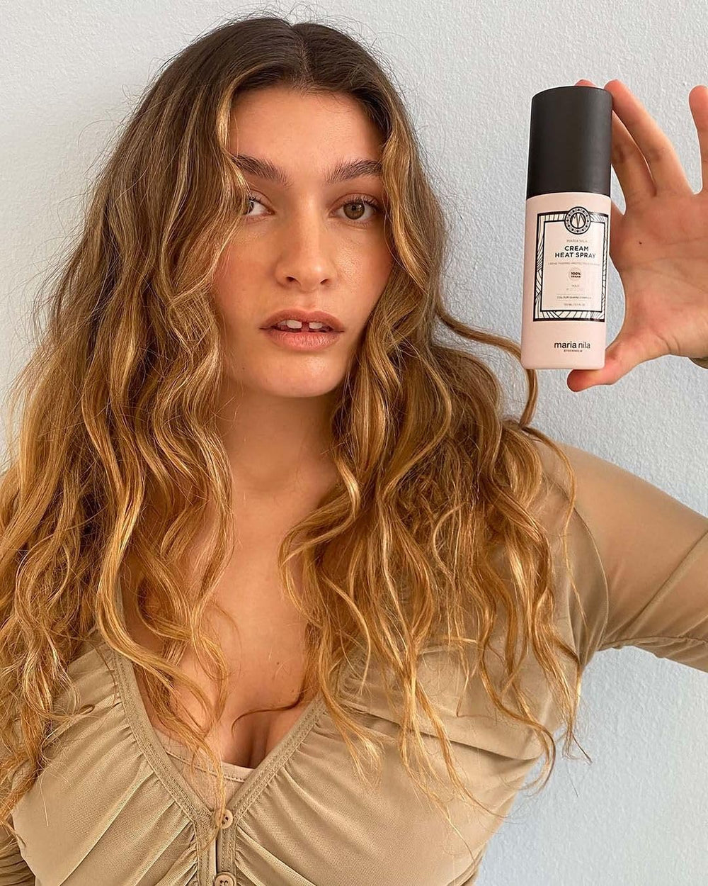 Maria Nila Cream Heat Spray packaging highlights vegan, sulfate- and paraben-free formula