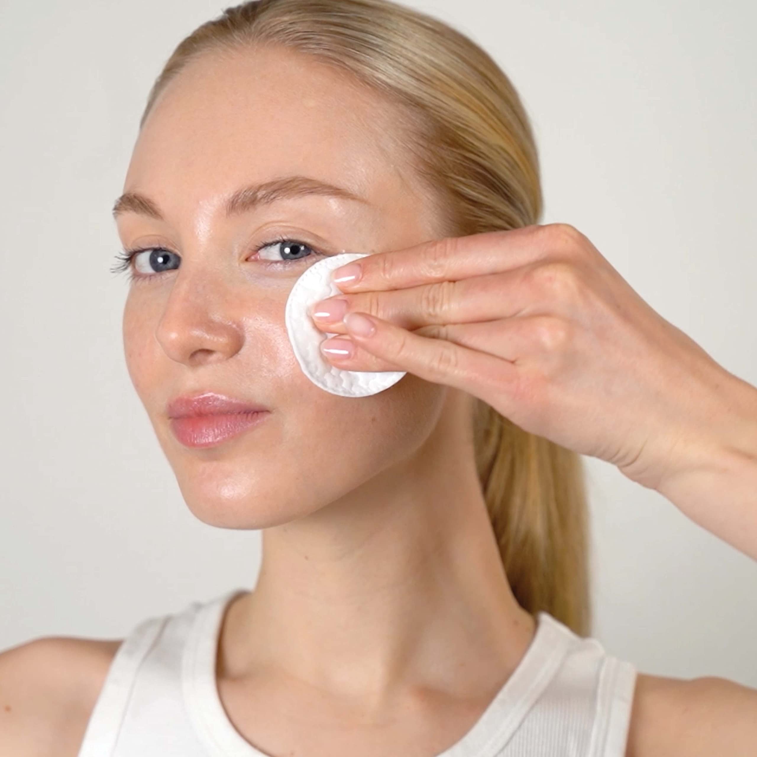 Close-up of Mario Badescu Glycolic Toner label emphasizing texture refinement.