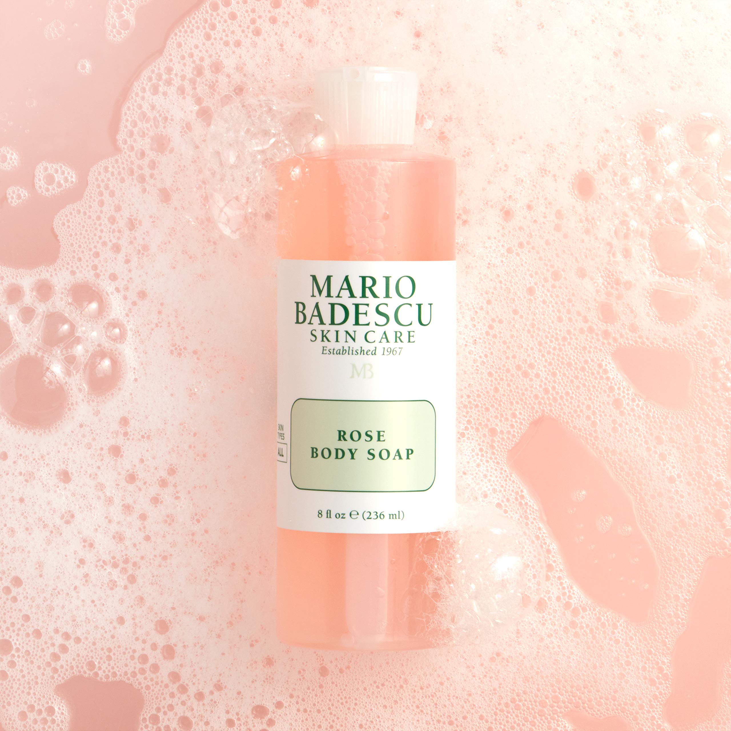 Mario Badescu Rose Body Soap foam lather on loofah for refreshing cleanse.