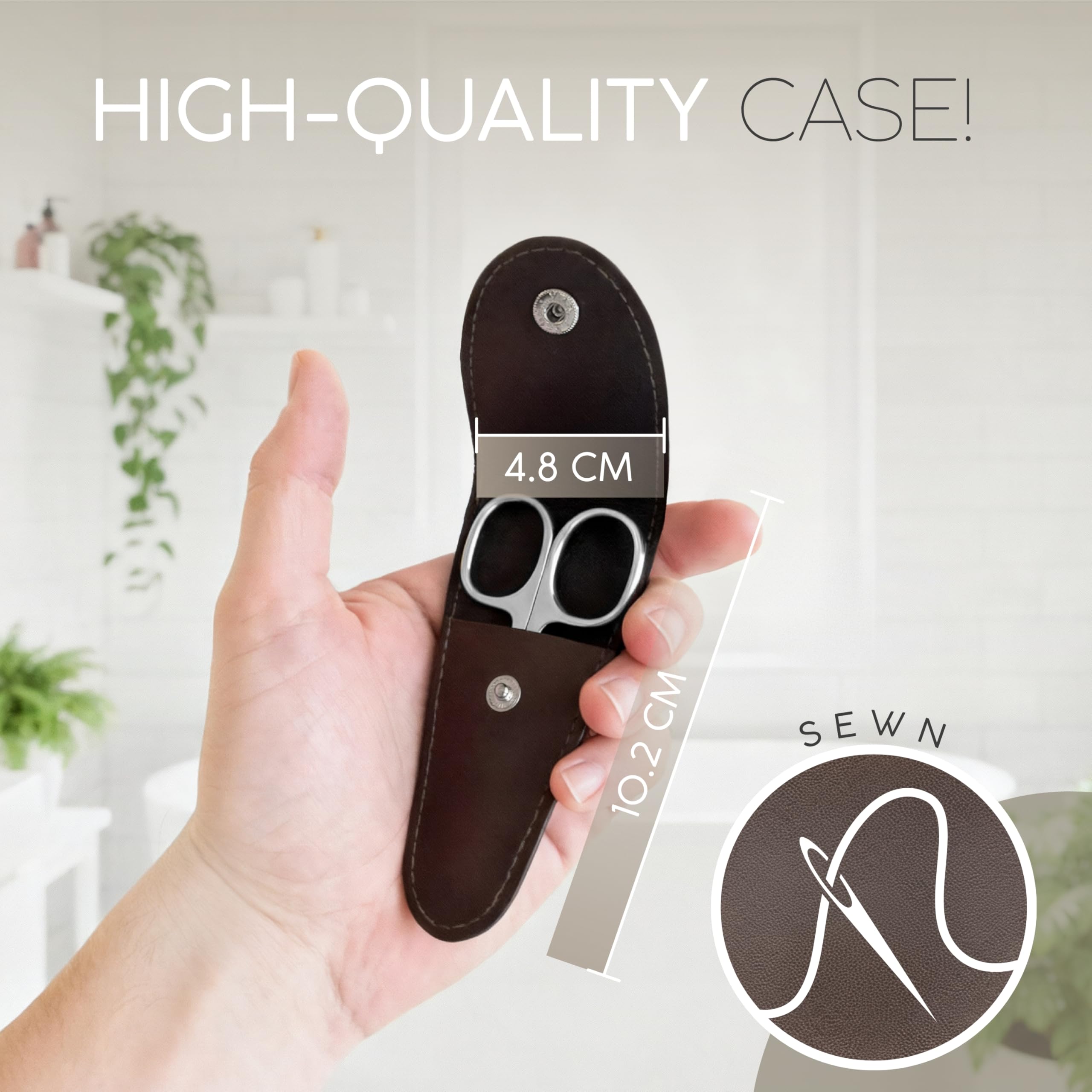 MarQus Solingen curved cuticle scissors in hand for nails and grooming.