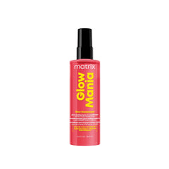 Matrix Glow Mania leave-in bottle pour for quick, glossy styling on color-treated hair.
