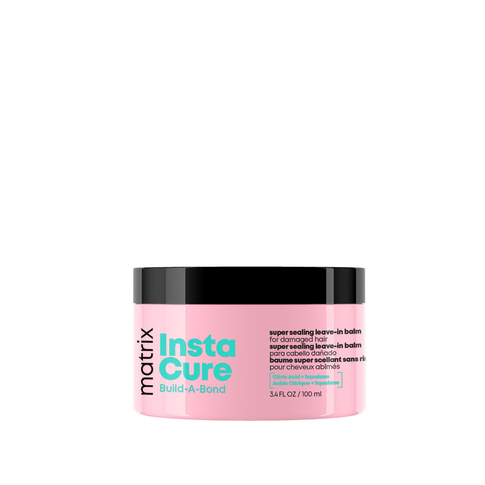 MATRIX Instacure balm bottle close-up showing bond-building formula for damaged hair.