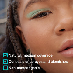 Maybelline Fit Me concealer being blended on cheek for natural finish.