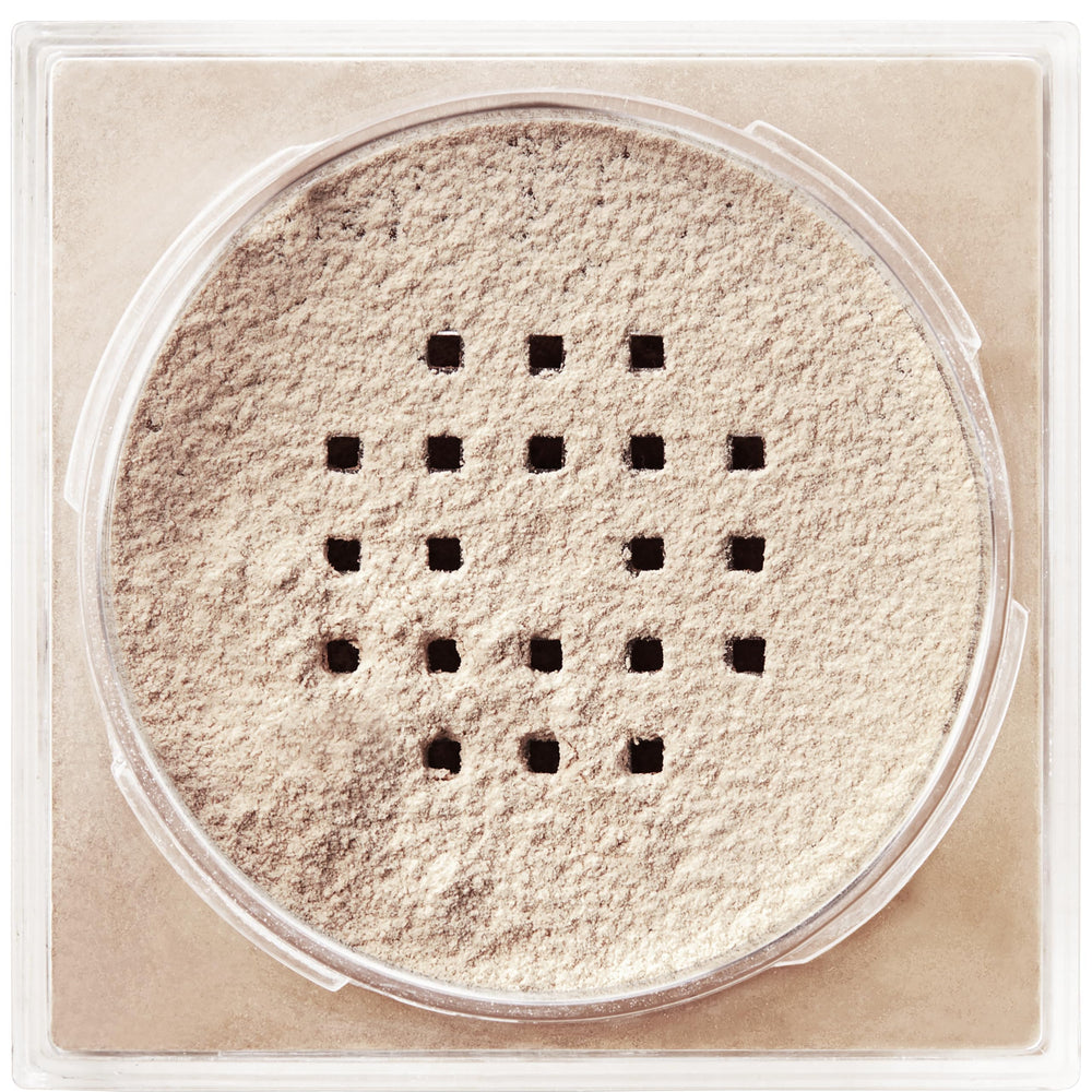Application brush swirled and powder dusted for even coverage with Maybelline.