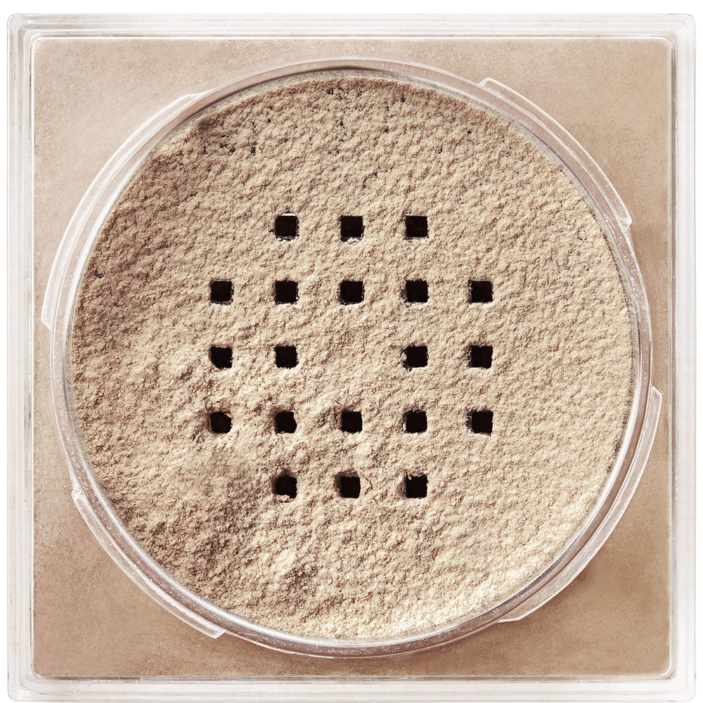Maybelline Fit Me loose powder packaging open shows convenient sifter for controlled application.