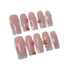 Meemooron diseños florales en uñas postizas para una apariencia delicada.