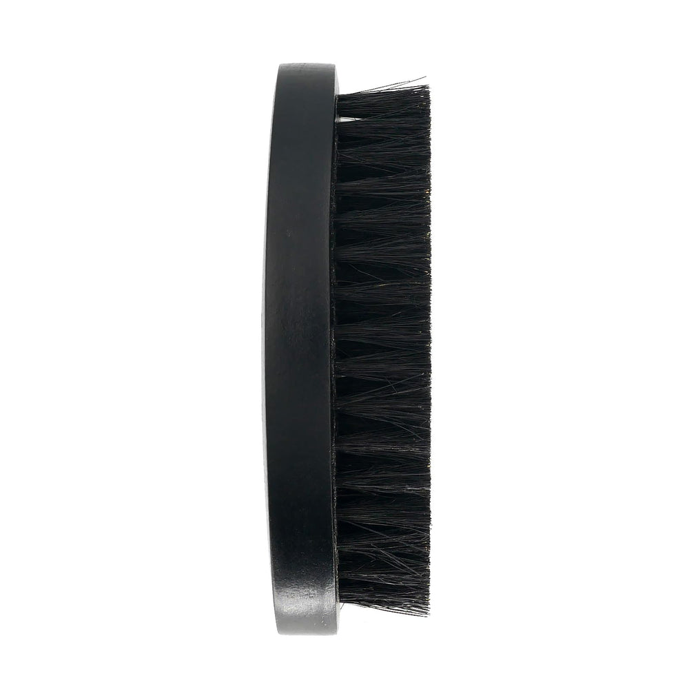 Menesia compact wooden beard brush fits easily in a pocket.