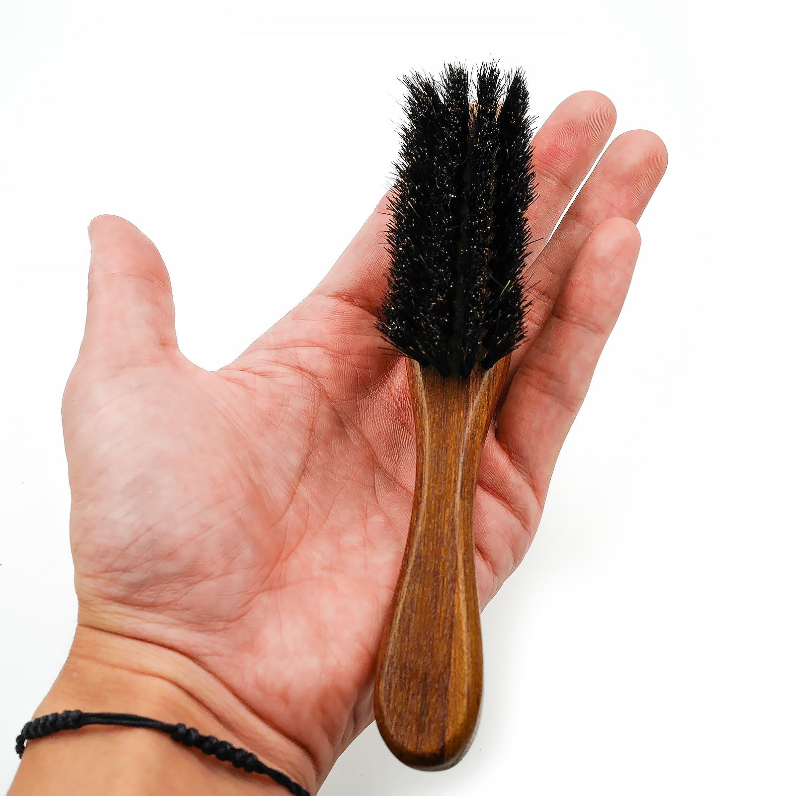 Menesia travel-friendly beard brush shown in compact pocket form.