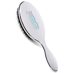 Mermaid Extension Care boar bristle brush in action for smoothing natural hair and extensions
