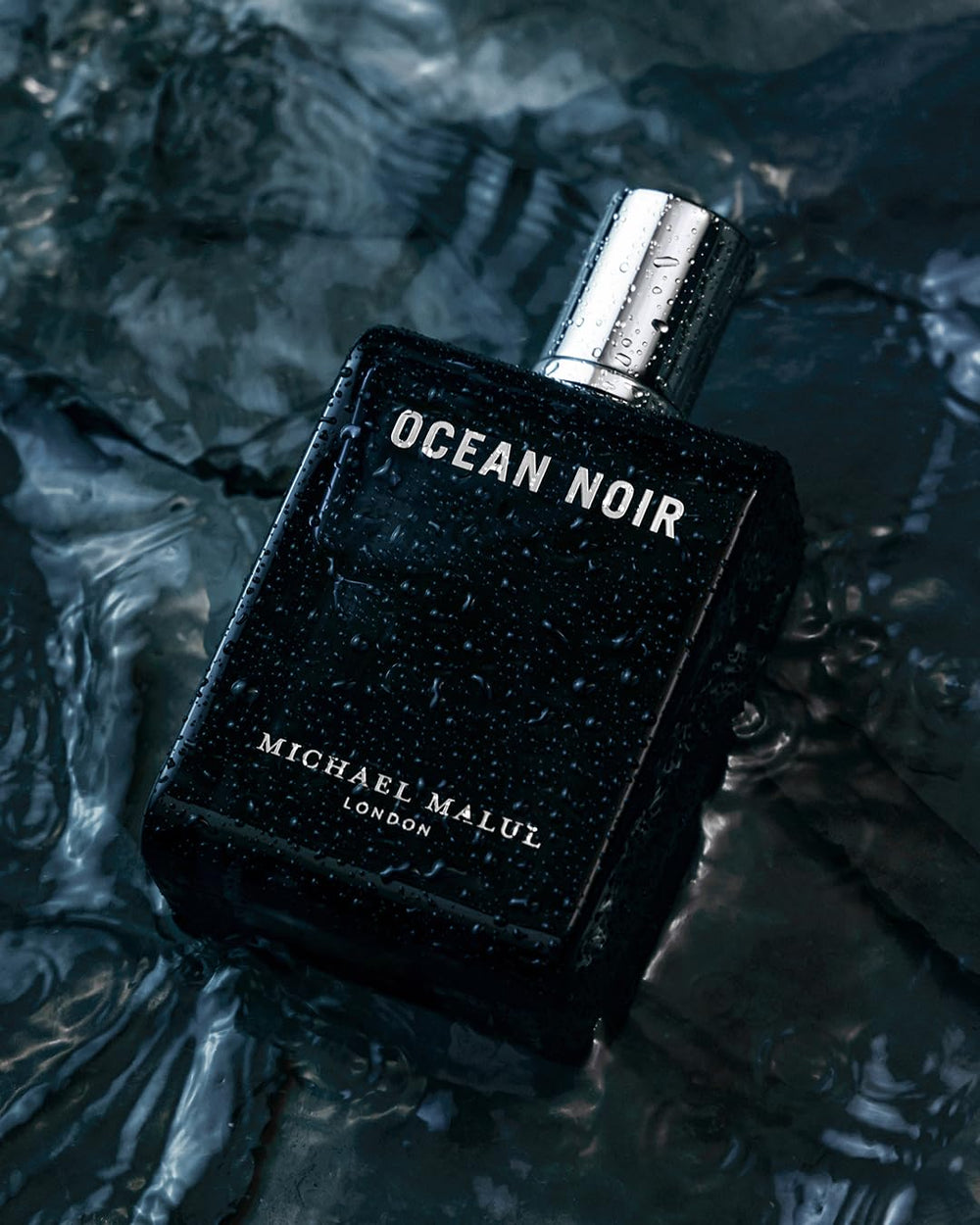 Michael Malul Ocean Noir bottle twist cap; travel-friendly design.
