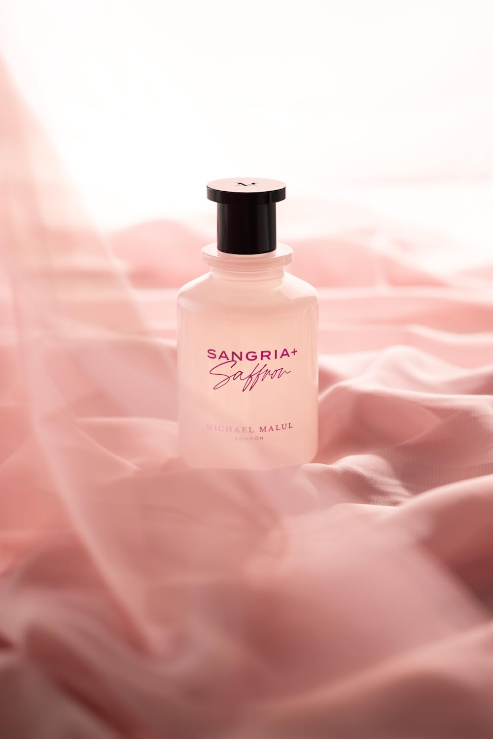Michael Malul Sangria + Saffron EDP close-up on label and suede detail.